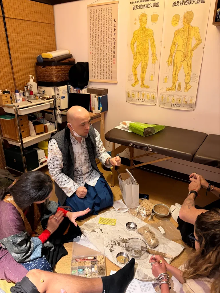 Teaching the acupuncture points on the hand.